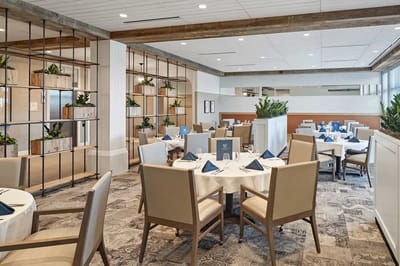 Elegant dining room setup with plants and tables
