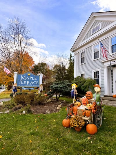 Exterior view of Maple Terrace with autumn decorations