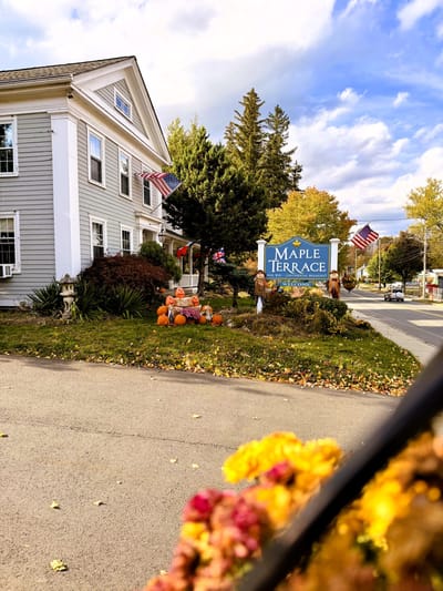 Exterior view of Maple Terrace with fall decorations
