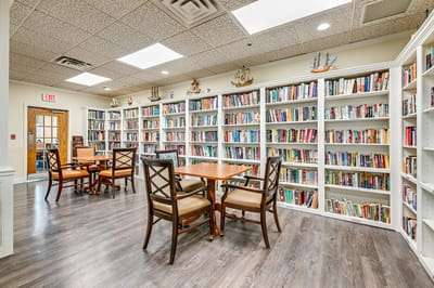 Cozy library area with bookshelves and seating