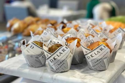 Delicious muffins displayed on a marble platter