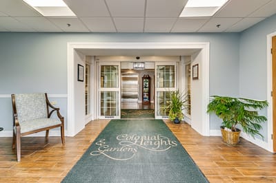 Interior lobby with entrance mats and seating