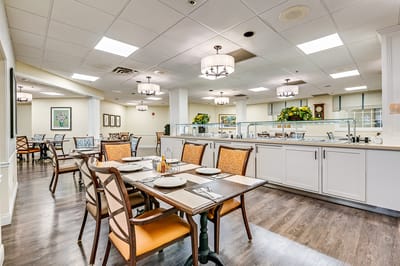 Dining area with tables set for residents