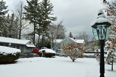 Outdoor view of a snowy landscape with residential buildings