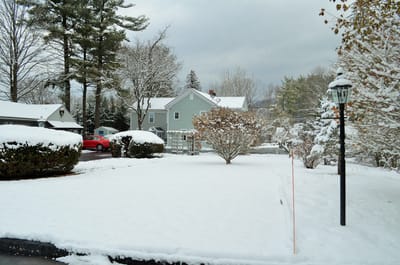Snow-covered exterior of a senior care facility