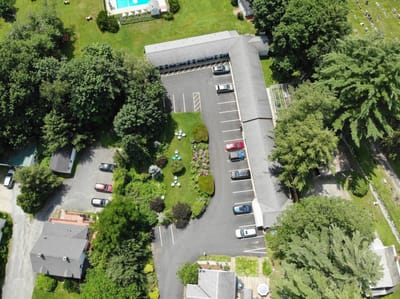 Aerial view of a senior living facility with outdoor areas