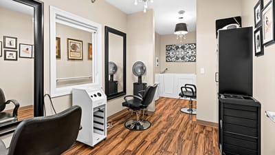 Hair salon interior with styling chairs and mirrors