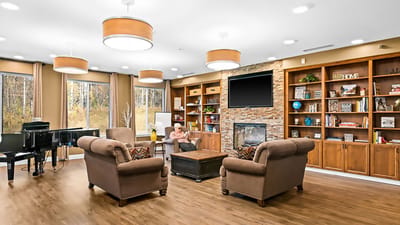 Common area with residents relaxing and reading