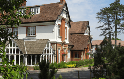 Exterior view of Charters Village facility, showcasing gardens