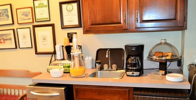 Interior view of a kitchenette with food and drinks