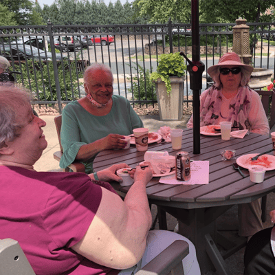 Residents enjoying refreshments outdoors