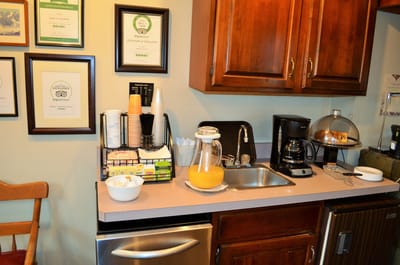 Kitchen area with refreshments and certificates