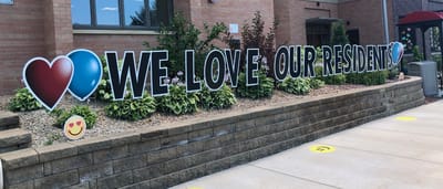 Outdoor sign expressing love for residents