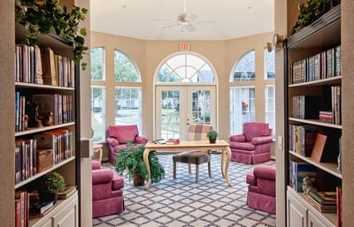 Common area with seating and bookshelves