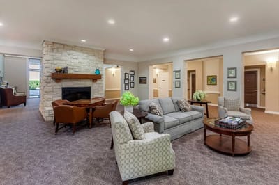 Interior common area with seating and a fireplace