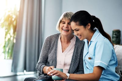 Caregiver interacting with a resident in a cozy setting