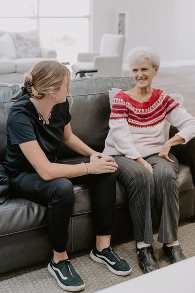 Staff member engaging with a resident in a common area