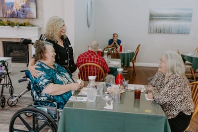 Residents enjoying a meal in the dining room