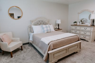 Cozy private bedroom with a neatly made bed