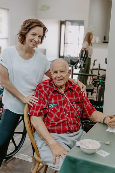 Staff member with a resident in a communal area