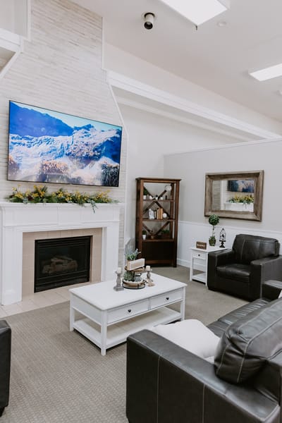 Cozy common area with seating and a fireplace