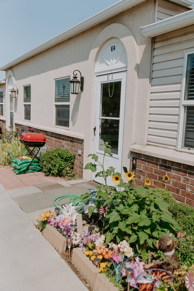 Exterior view of a resident unit with flowers