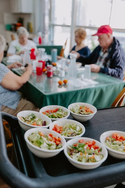 Residents enjoying a meal at a dining area