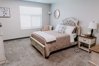 Cozy resident room with a bed and natural light