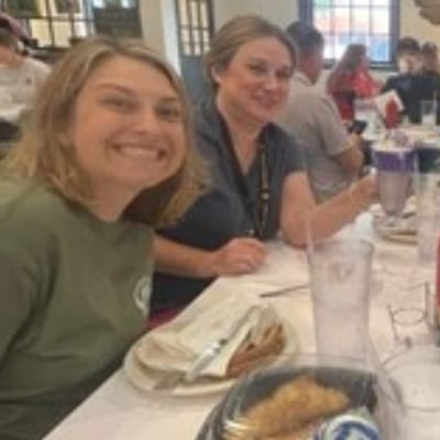 Residents and staff enjoying a meal together