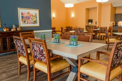 Dining room with tables and floral decor