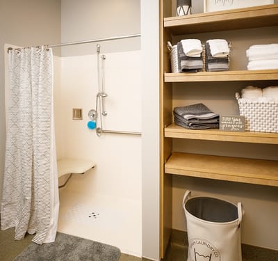 Clean and organized bathroom with towels and toiletries