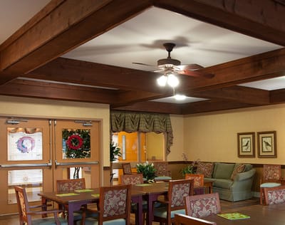 Bright dining area with wooden furniture and decor