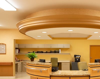 Reception area with a round ceiling and granite counter