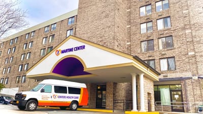 Exterior view of the Martine Center building and shuttle