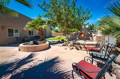 Outdoor courtyard with seating and palm trees