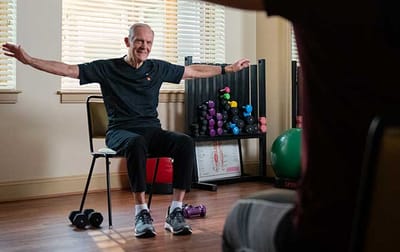 Senior participating in an exercise activity indoors