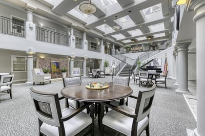Bright interior common area with seating and decorations