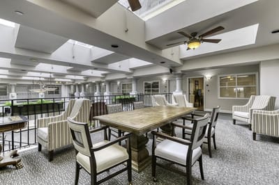 Bright common area with seating and skylights