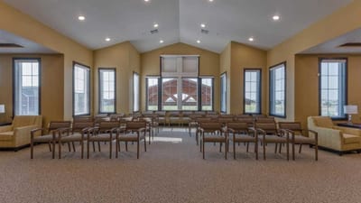 Bright common area with seating and large windows