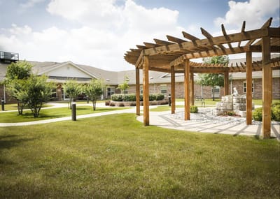 Outdoor garden space with pergola and landscaping