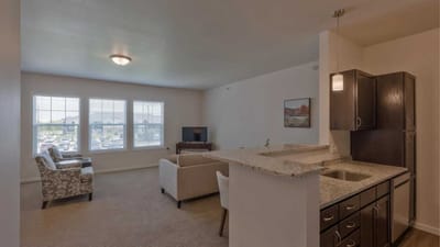 Cedar Ridge Village, nursing home in West Des Moines, IA — Spacious living area with modern kitchen and seating