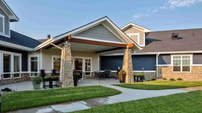 Cedar Ridge Village, nursing home in West Des Moines, IA — Welcoming entrance of a senior living facility with landscaping
