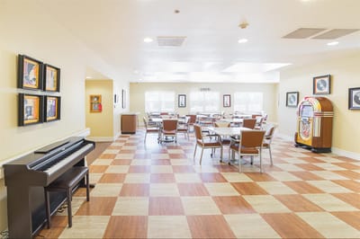 Bright social area with seating and a jukebox