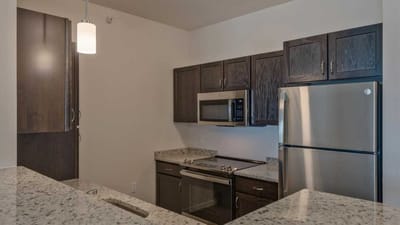 Cedar Ridge Village, nursing home in West Des Moines, IA — Modern kitchen with stainless steel appliances and granite countertops