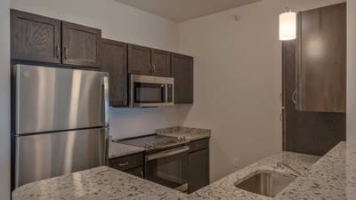 Cedar Ridge Village, nursing home in West Des Moines, IA — Modern kitchen with stainless steel appliances and granite countertops