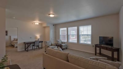 Cedar Ridge Village, nursing home in West Des Moines, IA — Cozy living room with seating and natural light