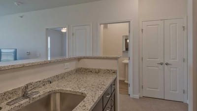 Cedar Ridge Village, nursing home in West Des Moines, IA — Modern kitchen with granite countertop and doorways