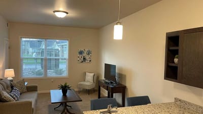 Cedar Ridge Village, nursing home in West Des Moines, IA — Cozy living room in a senior apartment layout