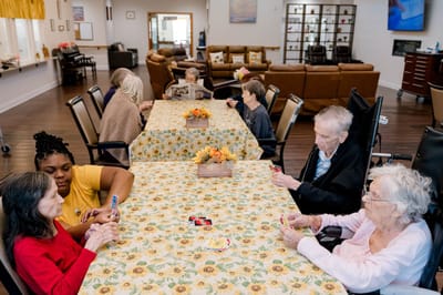 Residents playing cards in a common area