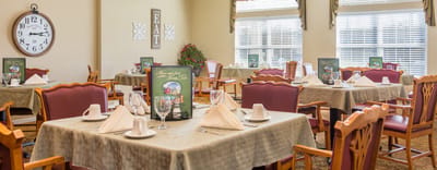 Dining area with neatly set tables and décor